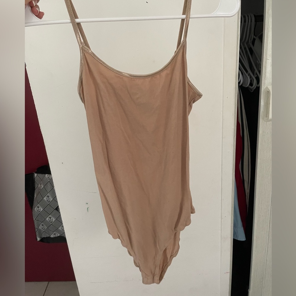 Tan body suit. New. Size L